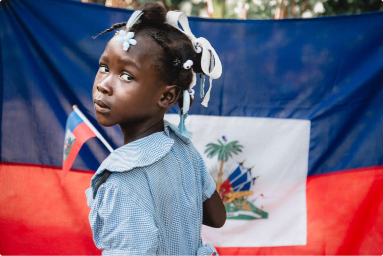 young girl with the haiti flag